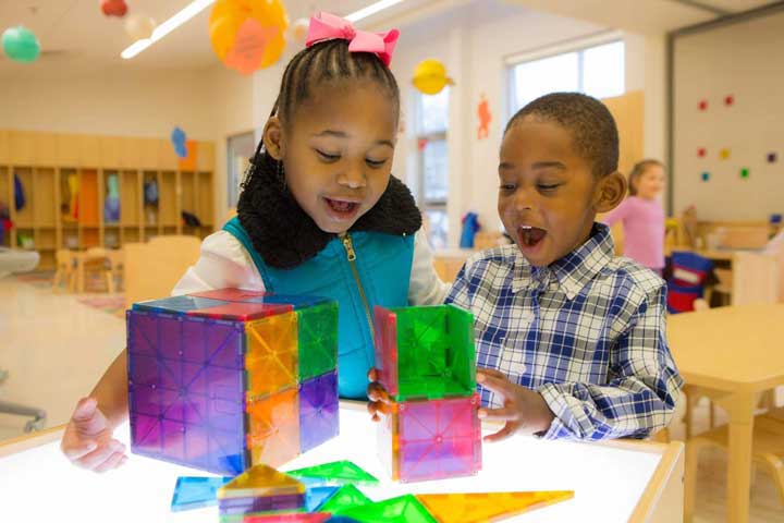 children play with colorful shapes