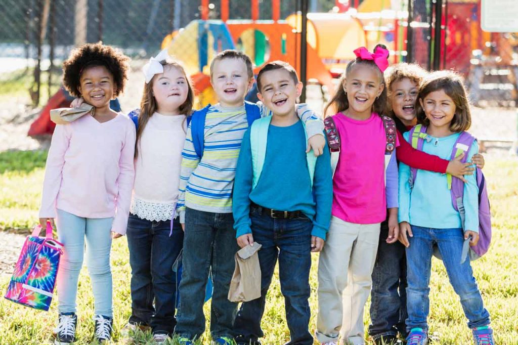 children on the playground smiling